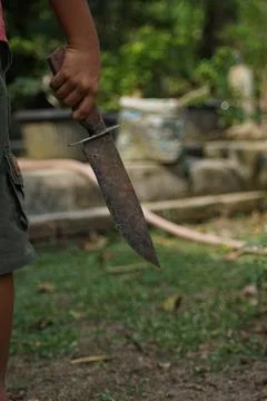 Boy with a dagger Foto stock
