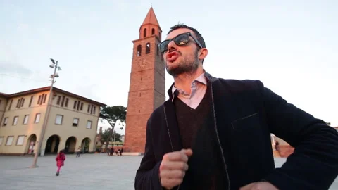 Boy dances in a square Stock Footage 132617855