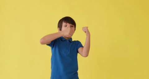 Boy dancing and giving thumbs up gesture Video stock 145235871