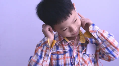 Boy dancing between listen music Stock Footage 38005617