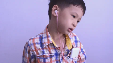 Boy dancing between listen music Video stock 38006092