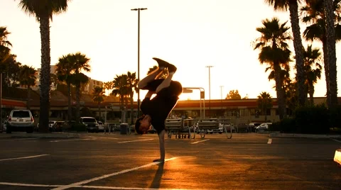 Boy dancing breakdance in front of a shopping mall in the U.S. in the sunset Stock-Footage 40367229