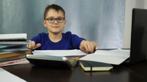 Boy dancing sitting at the table. study at home with children Stock Footage 145317340