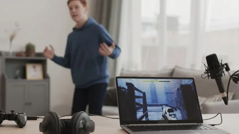 Boy Dancing While Computer Game on Pause Stock Footage 157533457