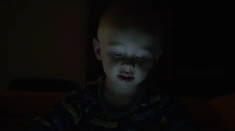 Boy Darkness Tablet Interacting - 4k Video stock 58804528