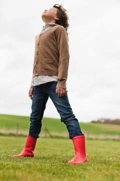 Boy daydreaming in a field Stock Photos