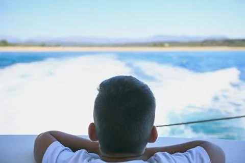 Boy in a deck of a cruise Stock Photos