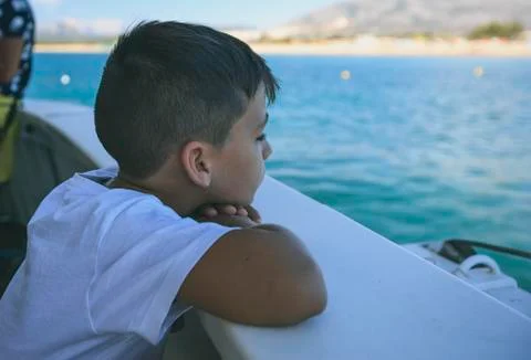 Boy in a deck of a cruise Stock Photos