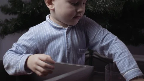 Boy decorate a Christmas tree Stock Footage 113752673
