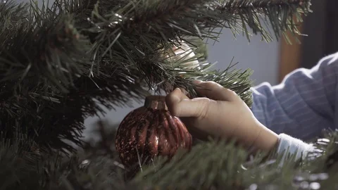Boy decorate a Christmas tree Stock Footage 113753083
