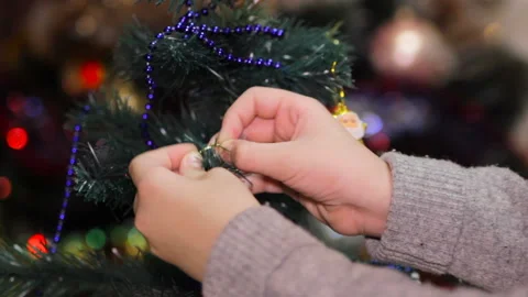 Boy decorates the Christmas tree Stock Footage 118855676