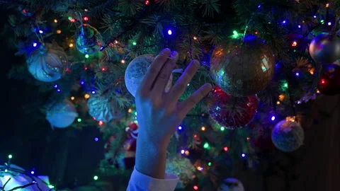 Boy decorating Christmas tree at home Stock Footage 219200889