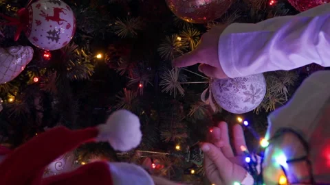 Boy decorating Christmas tree at home Stock Footage 219462003