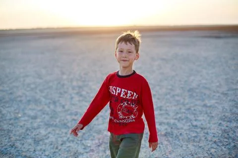 Boy in the desert Stock Photos