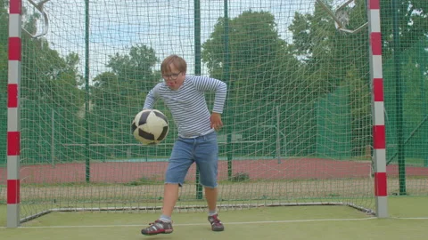 Boy develops dexterity. Physical characteristics in people with Down syndrome. Видео 157610733