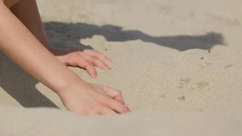A Boy is Digging in the Sand on the Beach Stock-Footage 347774974