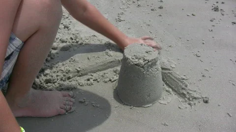 Boy digging in Sand Video stock 133782