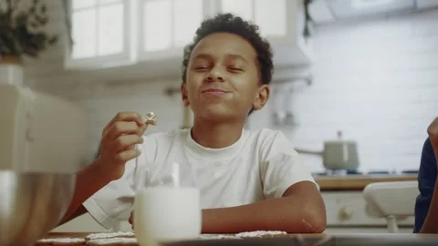 A Boy Dipping A Cookie Stock Footage 297054843