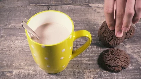 The boy dips cookies in cocoa Video stock 95317882