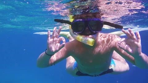 Boy dive in Red sea Stock Footage 90378214