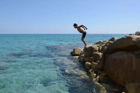 Boy dive into the sea Foto stock