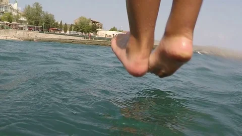 The boy dives into the water Stock Footage 84549563