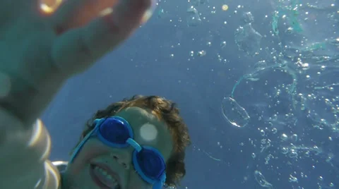 Boy diving and waving hand in Swimming Pool. Kids. Slow Motion Stock Footage 33822905