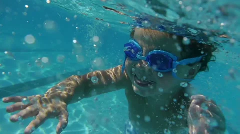 Boy diving in Swimming Pool. Kids. Slow Motion Stock Footage 33823060