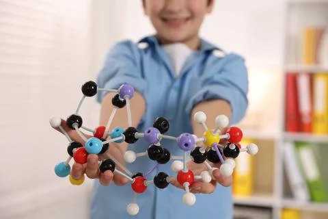 Boy with DNA structure model indoors, closeup Stock Photos
