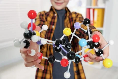 Boy with DNA structure model indoors, closeup 스톡 사진
