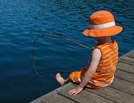 Boy on dock Stock Photos