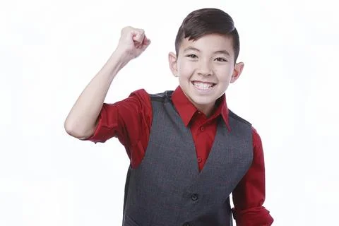 Boy does fist pump for camera. Stock Photos