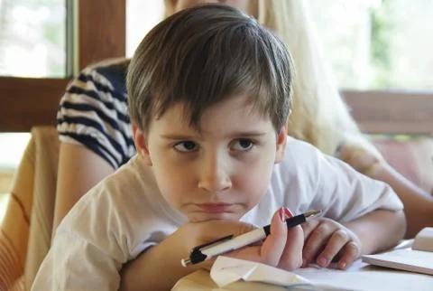Boy does his homework Stock Photos