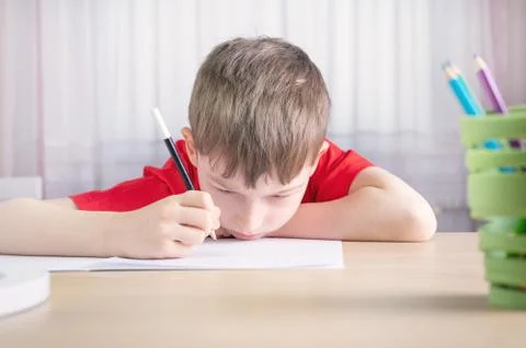 The boy does not want to do homework for school Stock Photos
