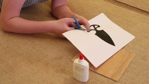 Boy does a wooden knife Stock Footage 204160847