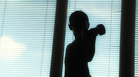 Boy doing gymnastics with dumbbells Stock Footage 48078360