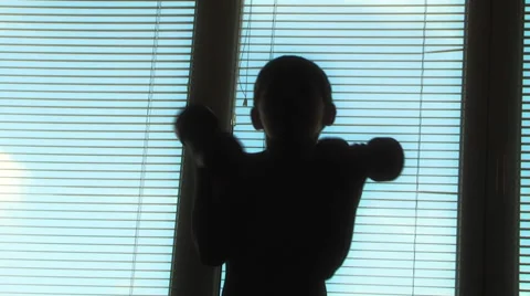 Boy doing gymnastics with dumbbells Stock Footage 48078425