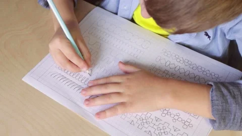 Boy doing his whiting practice. View from above Stock Footage 141598233