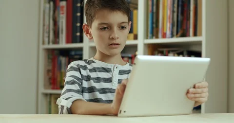 Boy doing homework on digital tablet. Stock Footage 127837890