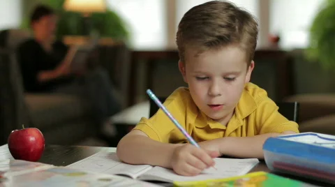 Boy doing homework, dolly shot Stock Footage 708377
