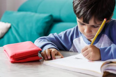Boy doing homework at home Stock Photos