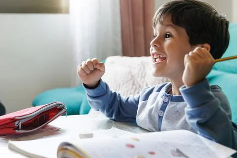 Boy doing homework at home Foto stock