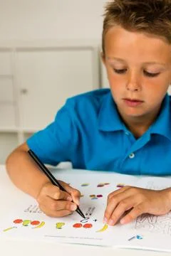 Boy doing homework Stock Photos