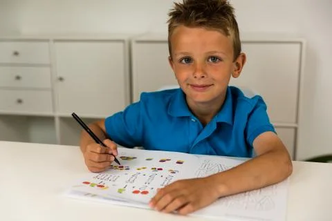 Boy doing homework Stock Photos