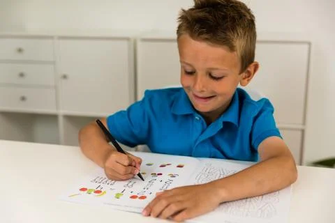 Boy doing homework Stock Photos