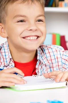 Boy doing homework Stock Photos