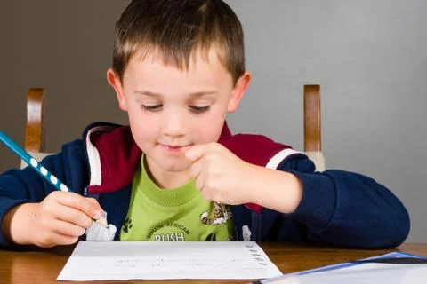 Boy doing homework Stock Photos