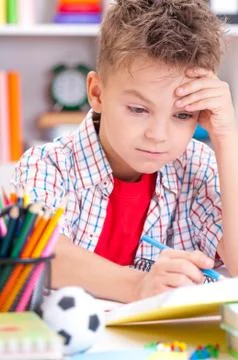 Boy doing homework Stock Photos