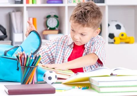 Boy doing homework Stock Photos