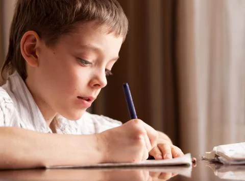 Boy doing homework Stock Photos